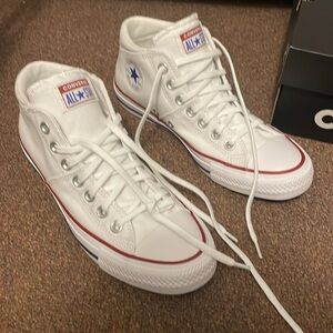 Never worn mid top canvas Converse sneakers
